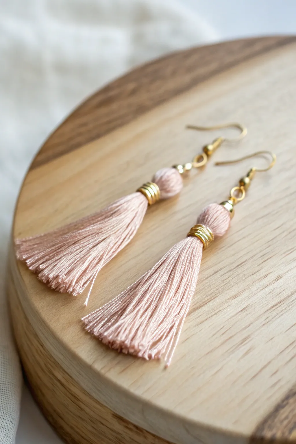 Add a touch of elegance and charm with handcrafted tassel earrings.