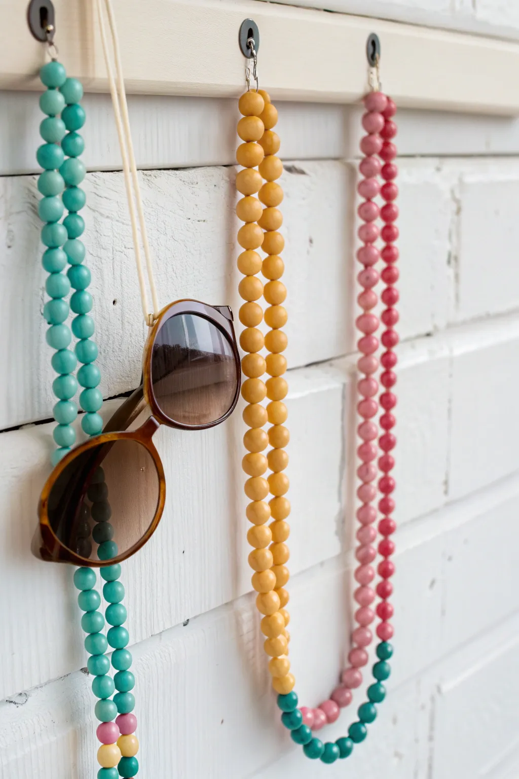 Add a touch of vibrant elegance to your entryway with this handcrafted melting beads sunglasses holder. Perfect for organizing in style!