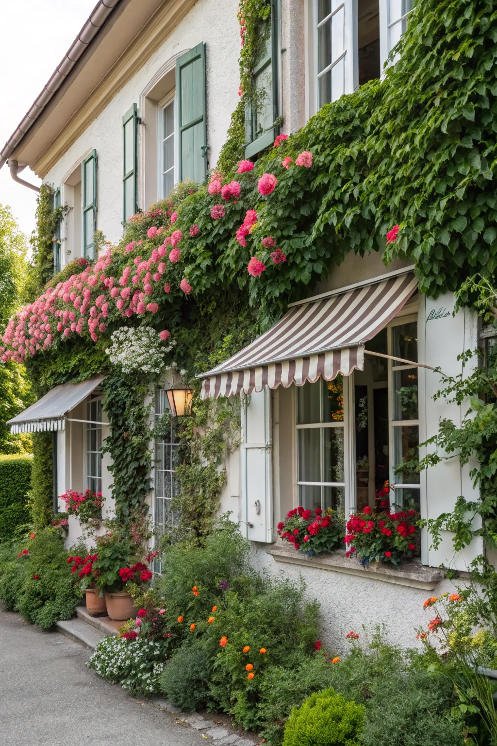 Lush greenery beautifully frames these farmhouse window awnings.