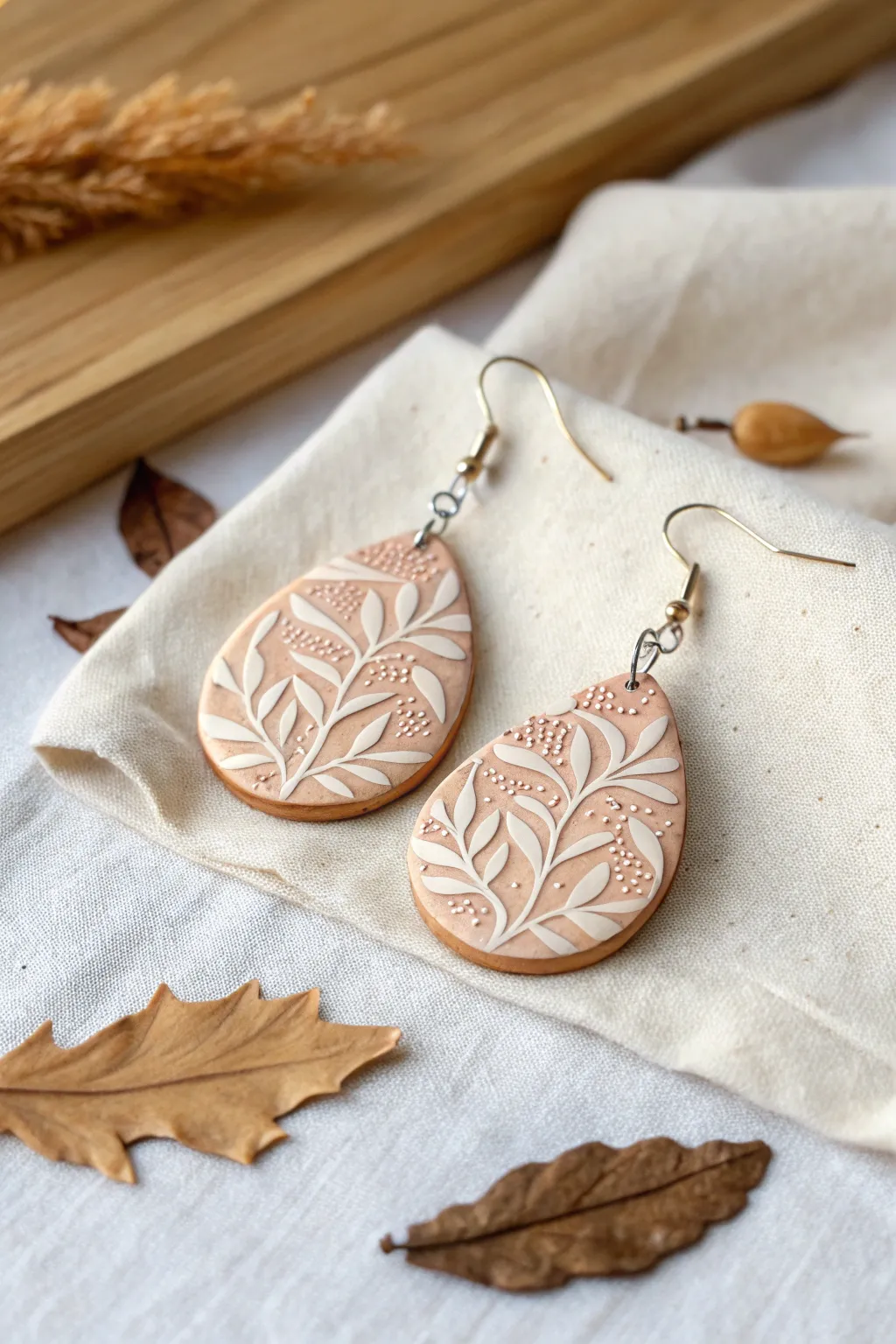 Embrace the elegance of nature with these beautifully crafted leaf-patterned polymer clay earrings.