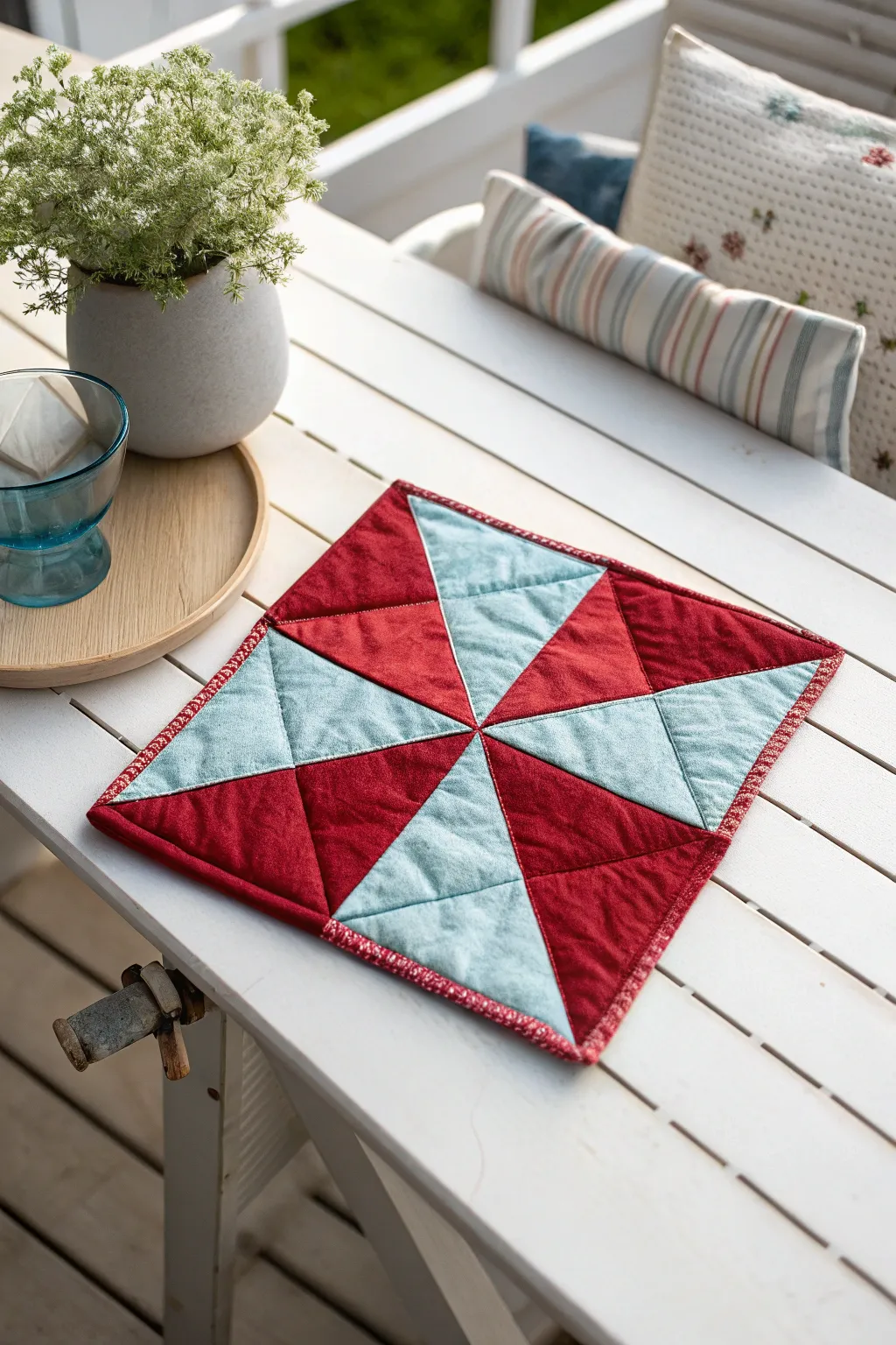 Discover the art of contrast: Bold reds meet soft blues in this stunning quilt block centerpiece.