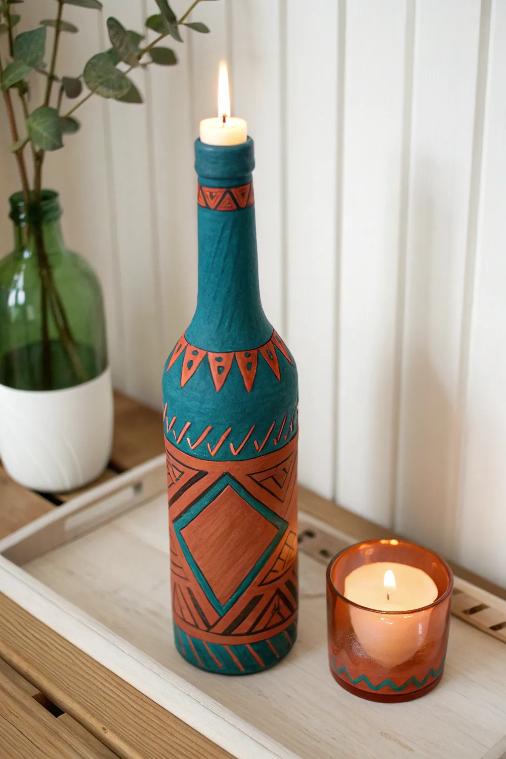 Transform old bottles into stunning candle holders for a touch of warmth and style in your home.