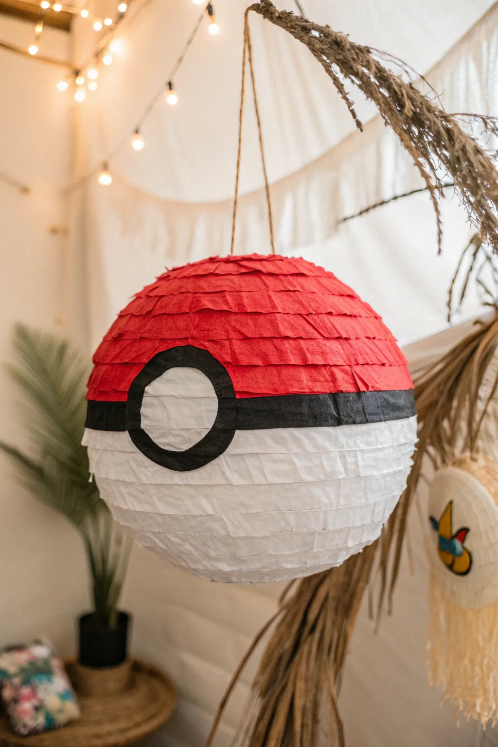 Catch some fun with this beautifully crafted Pokeball pinata!