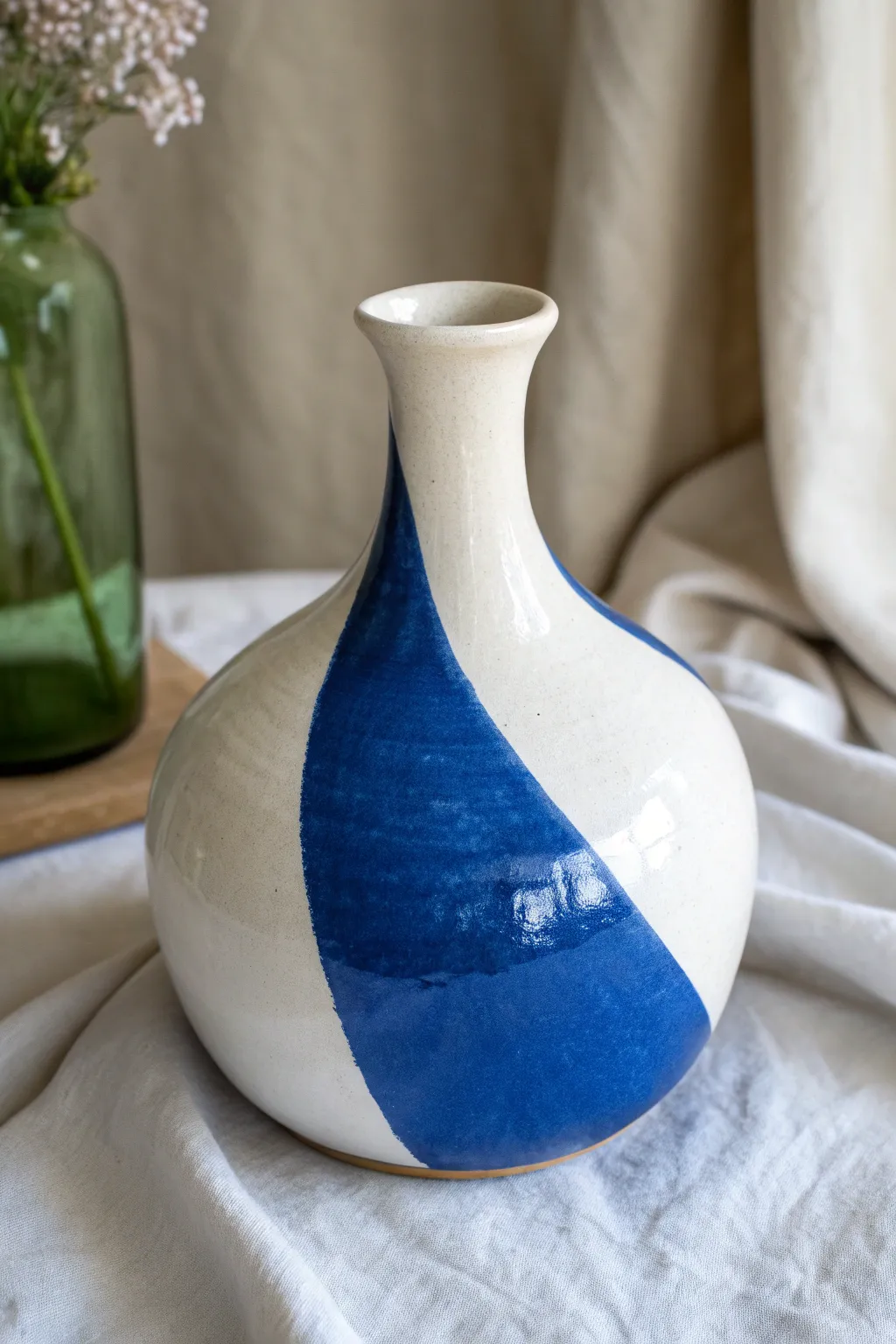 Discover the art of color contrast with this stunning blue and white vessel, where simplicity meets boldness.