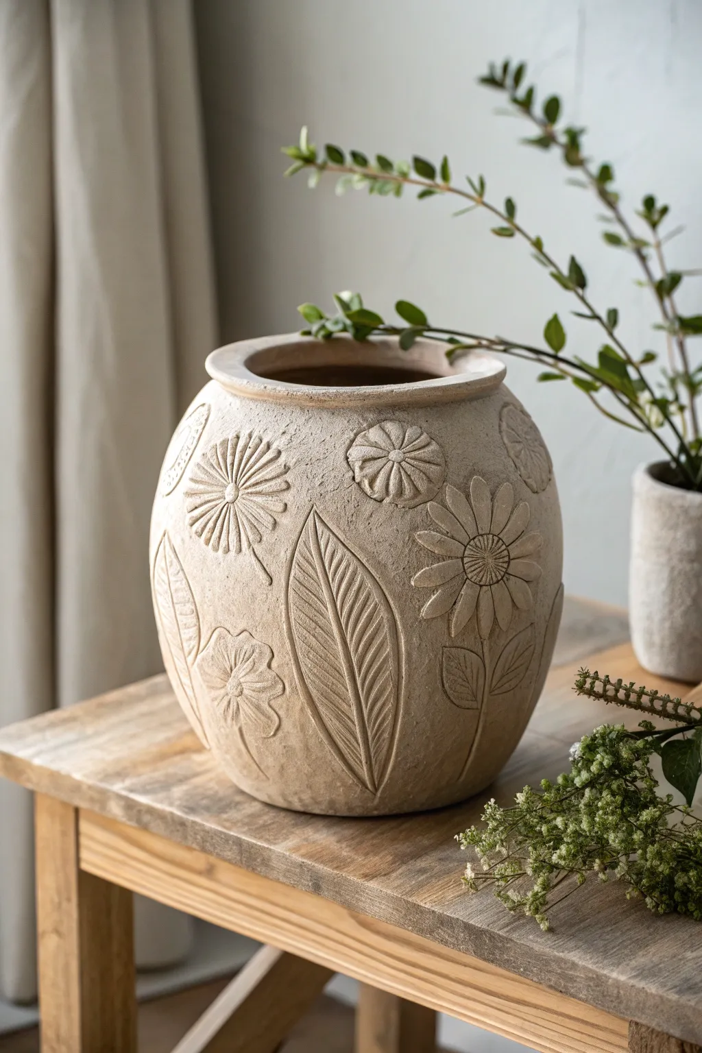 Embrace the beauty of nature with this exquisitely textured clay pot, a perfect blend of Scandinavian minimalism and bohemian elegance.