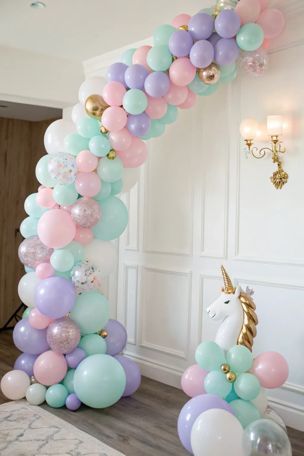 Step into a world of whimsy with this enchanting pastel balloon arch, perfect for a dreamy unicorn backdrop.