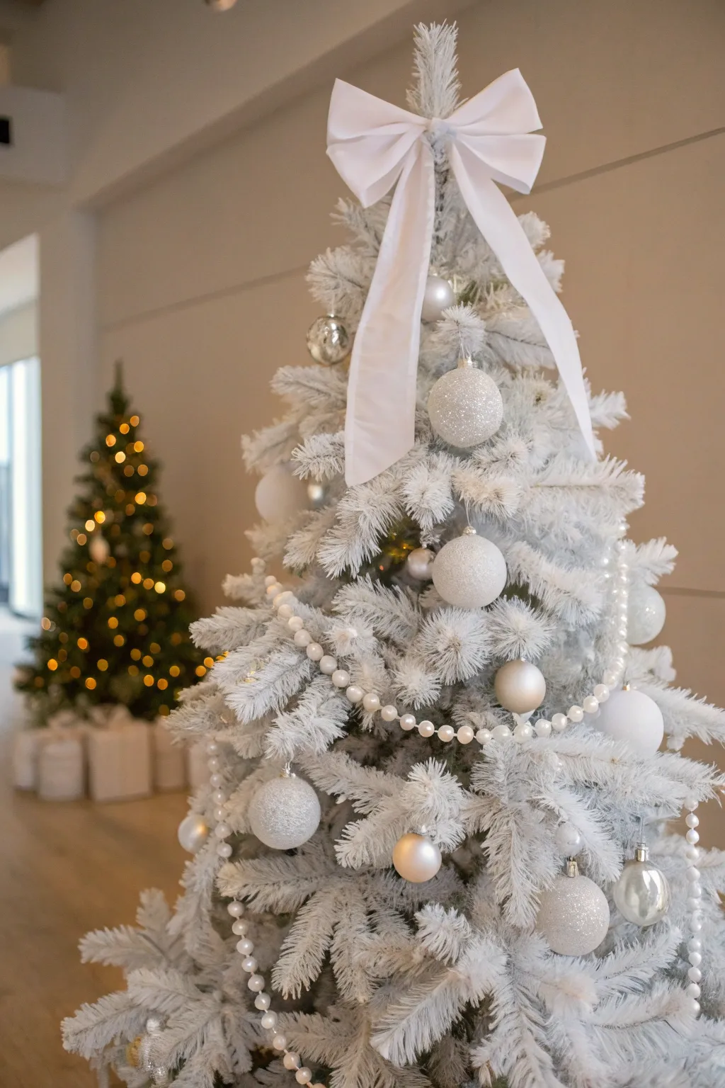An elegant ribbon bow creates a stunning focal point on this tree.