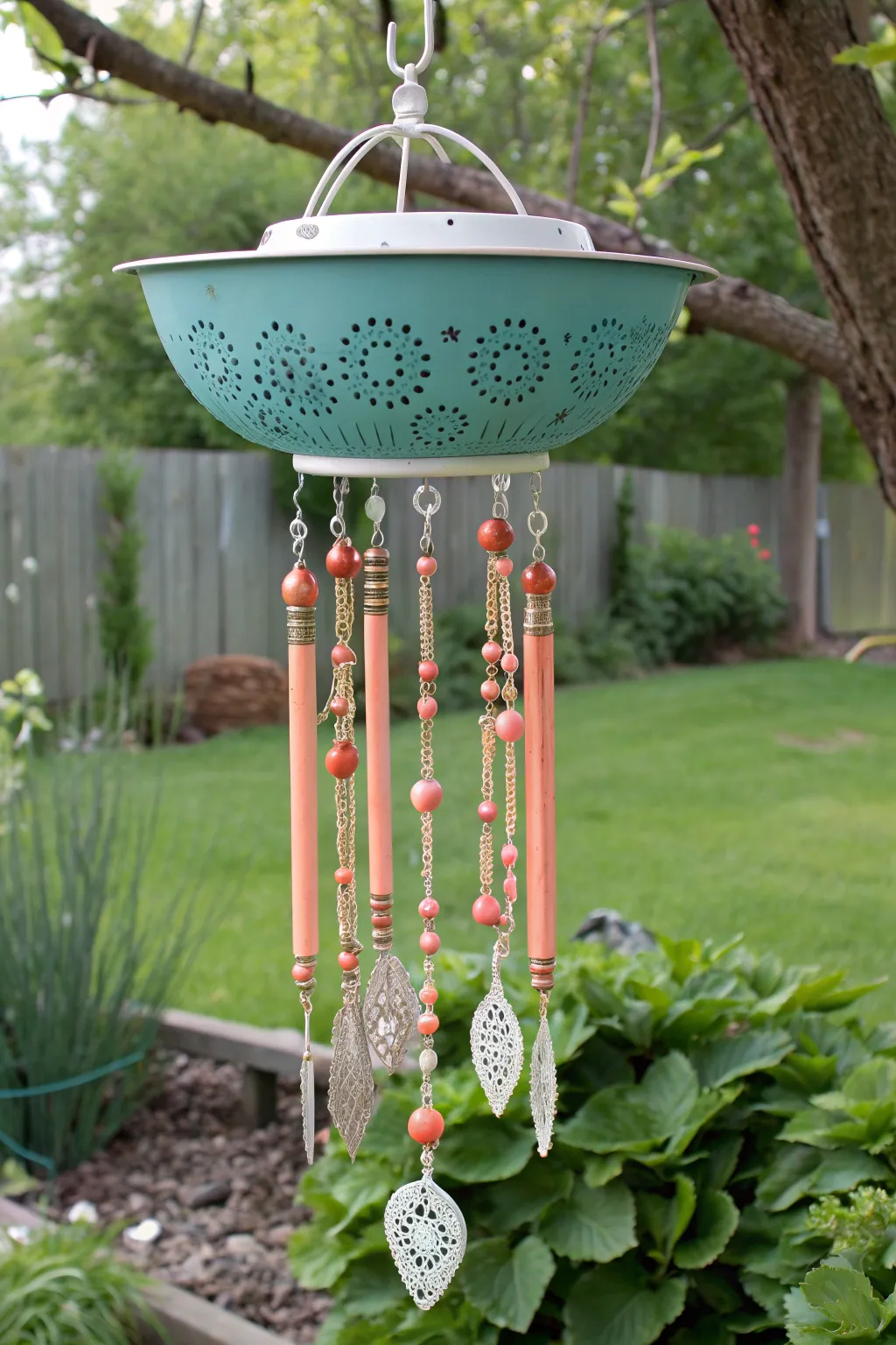Breathe new life into the garden with a charming vintage sifter wind chime stand—where nostalgia meets elegance.