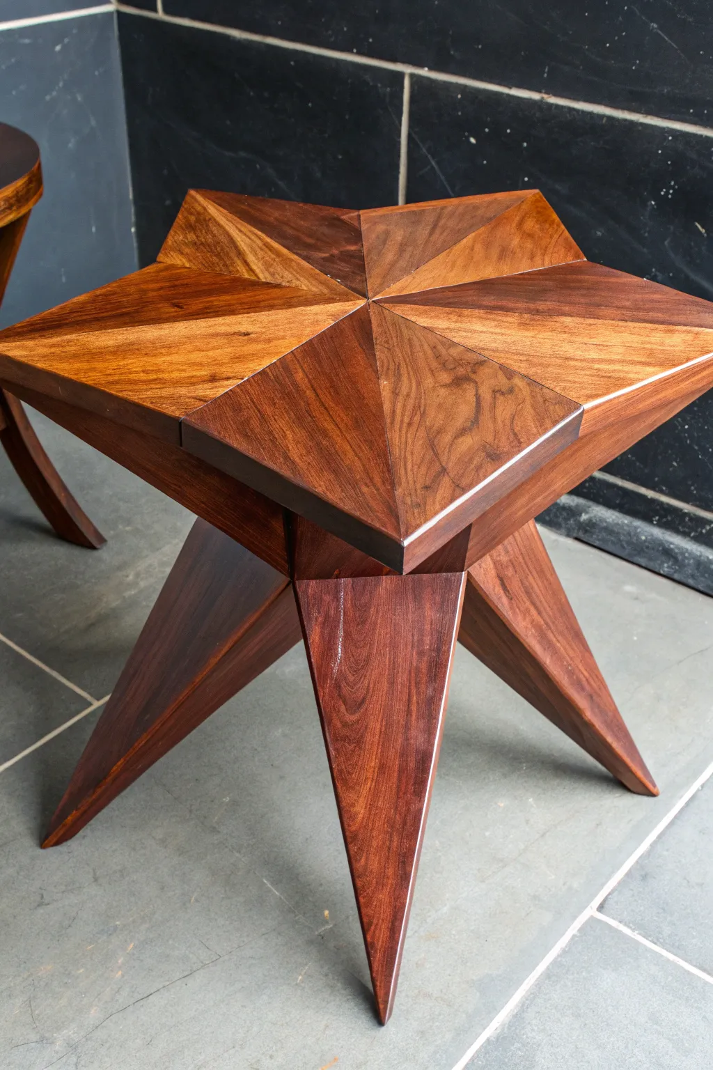 Elevate your space with a handcrafted star-shaped side table that showcases exceptional woodworking craftsmanship.