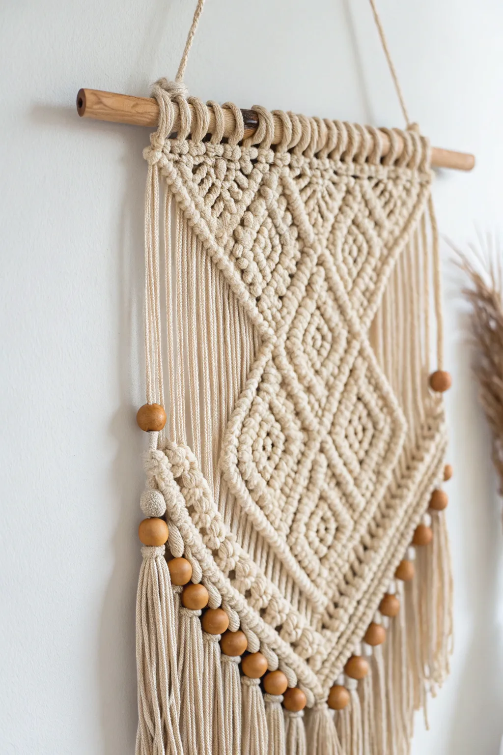 Elevate your space with handcrafted elegance: a minimalist wall hanging that speaks of natural beauty and personal style.