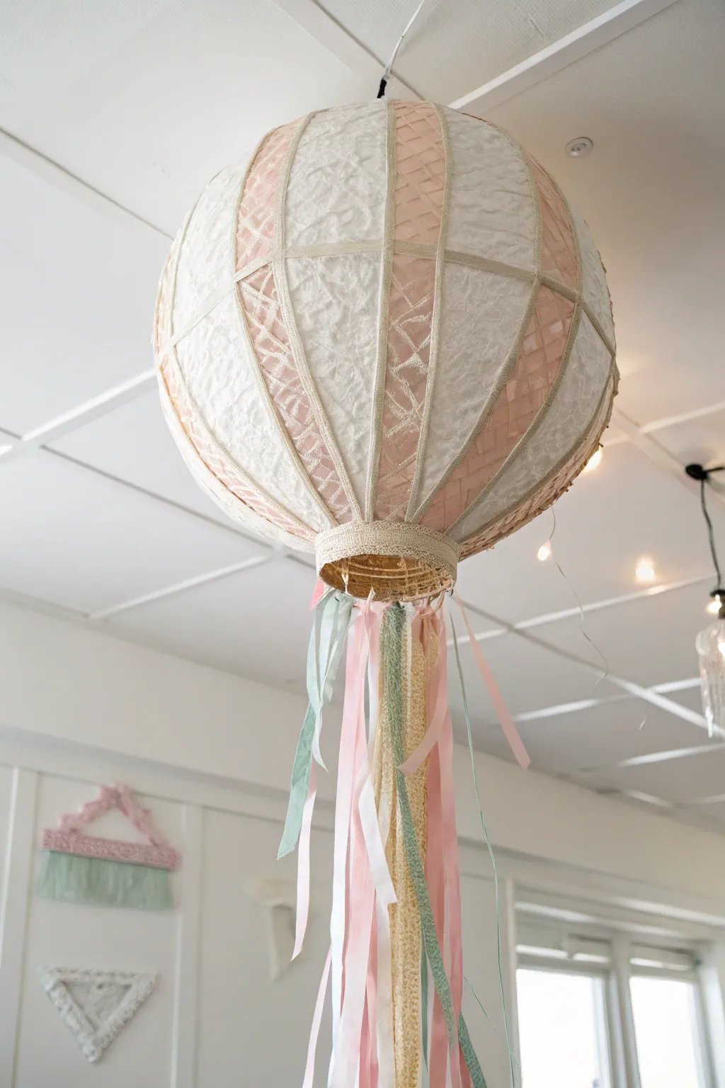 Elevate your decor with a touch of whimsy and elegance through a beautifully crafted hanging balloon pinata.