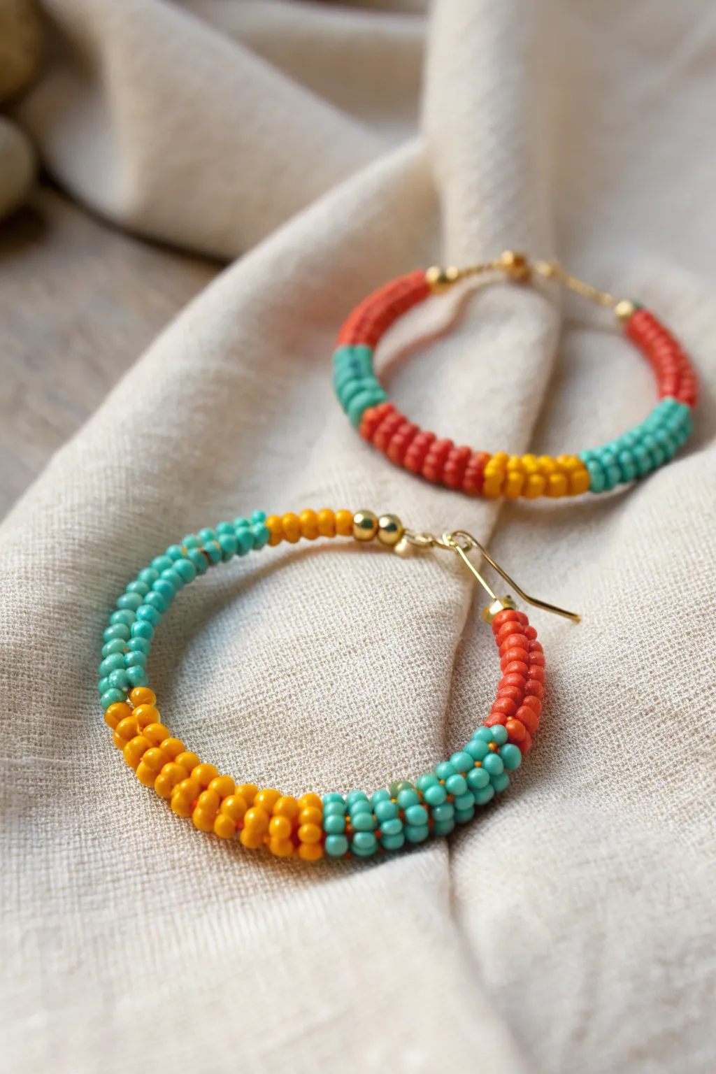 Brighten your day with these vibrant beaded hoop earrings, perfect for a subtle splash of color.