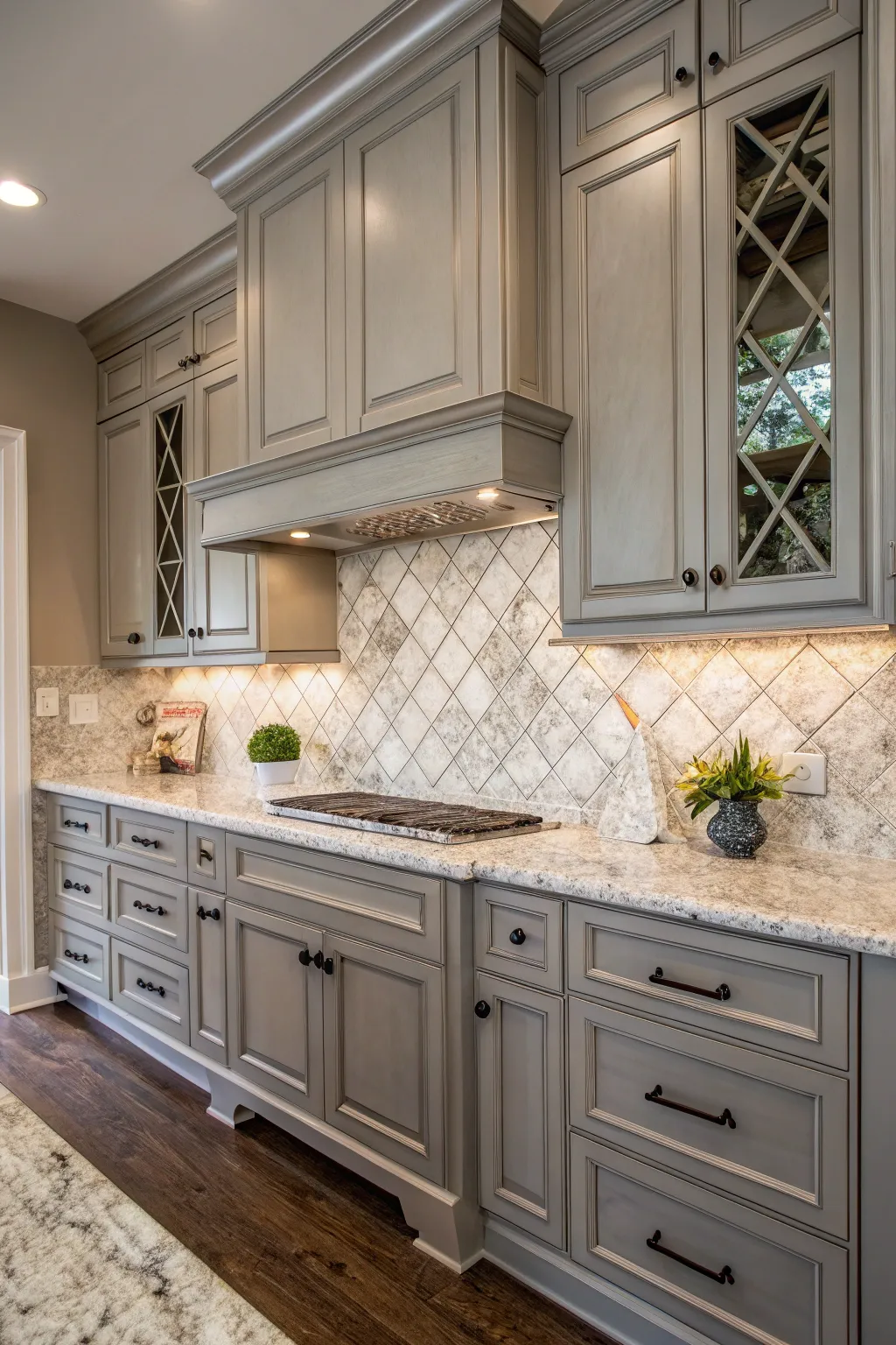 Sophisticated elegance with Bianco Antico granite and gray cabinets.