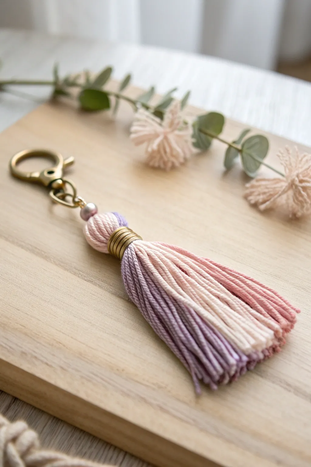 Add a touch of playful elegance to your essentials with a handcrafted tassel keychain.