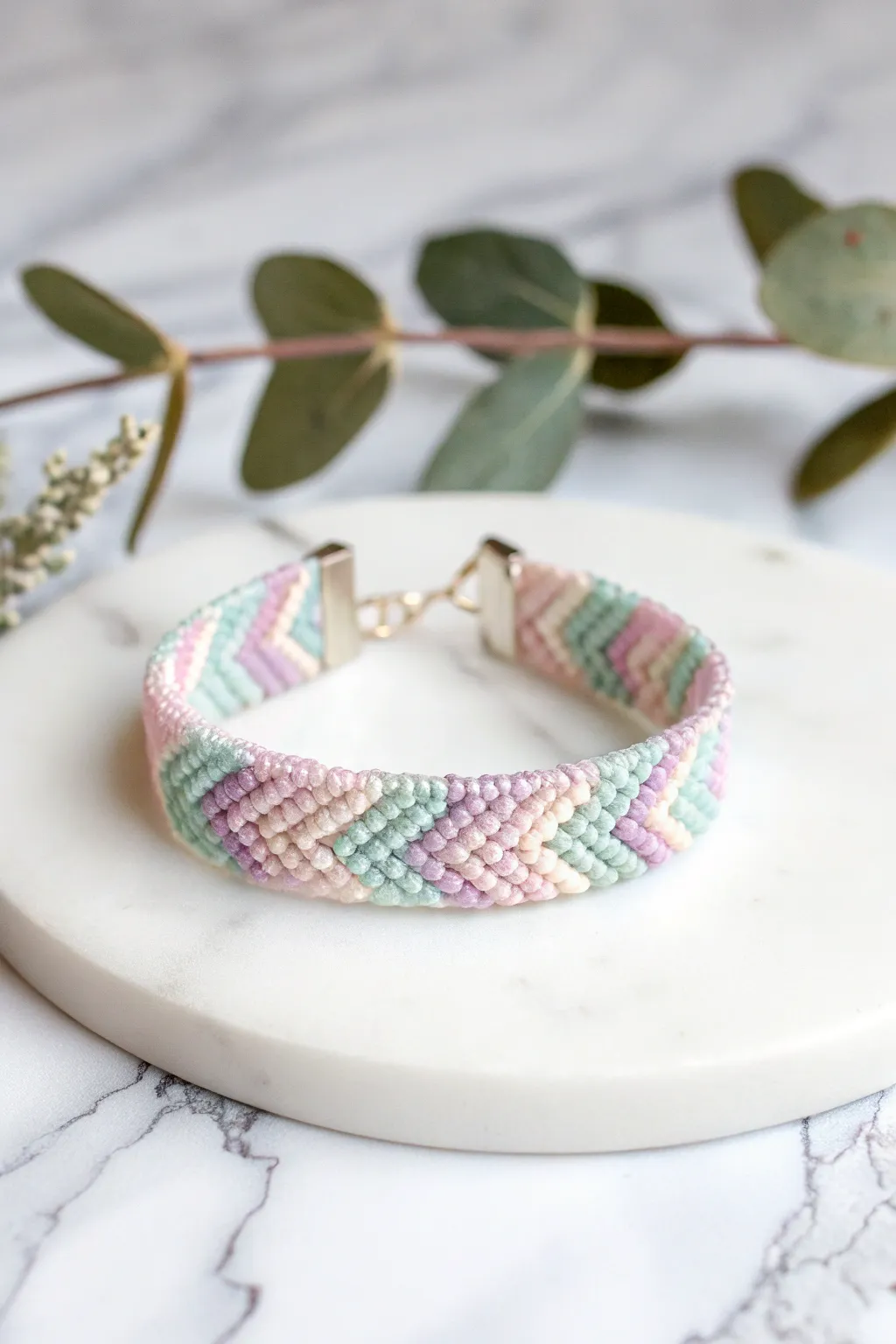 Embrace the gentle charm of pastel perfection with this exquisitely crafted chevron bracelet.