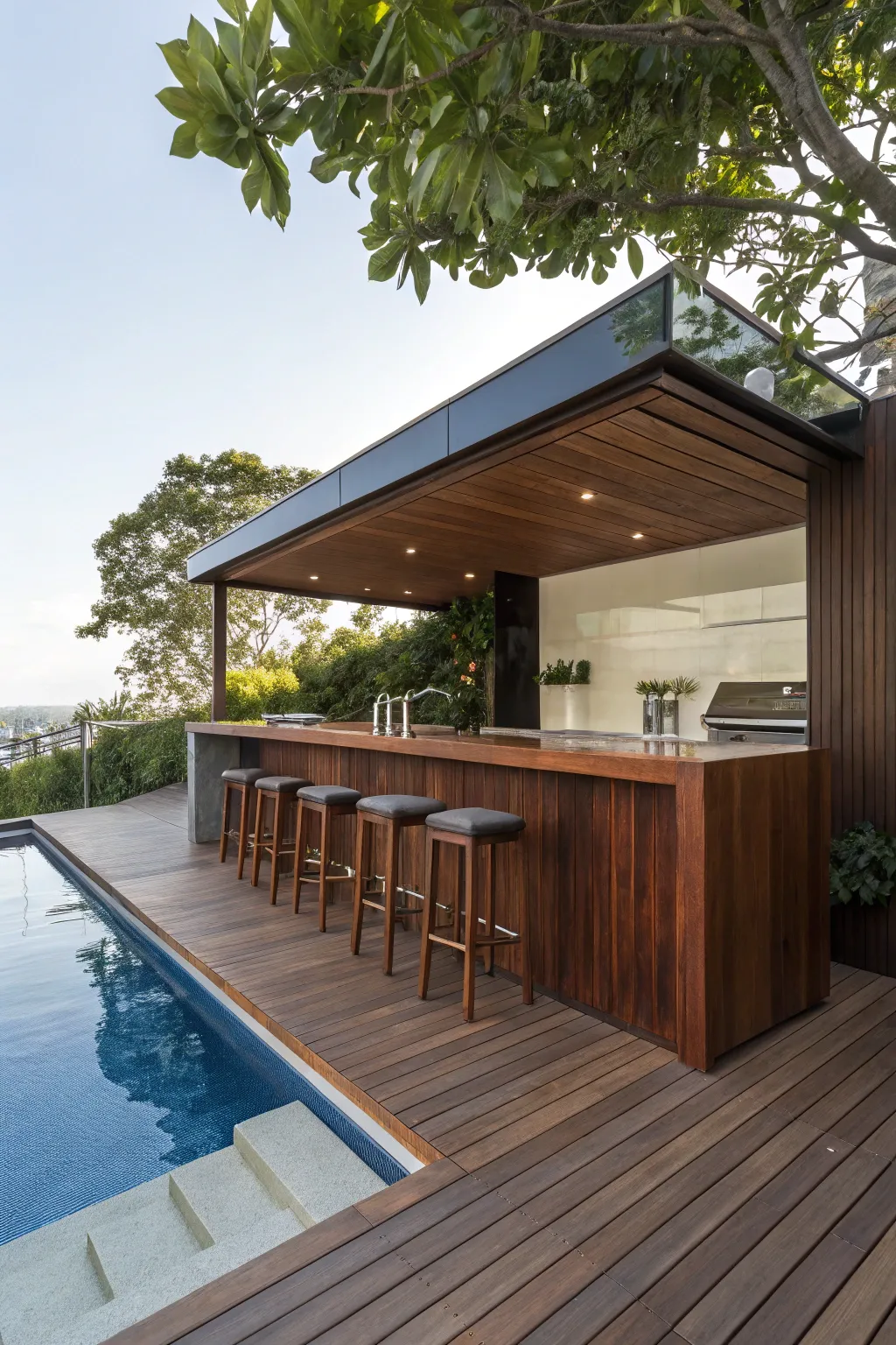 Elevate your poolside experience with a deck-integrated bar: the perfect blend of style and functionality.