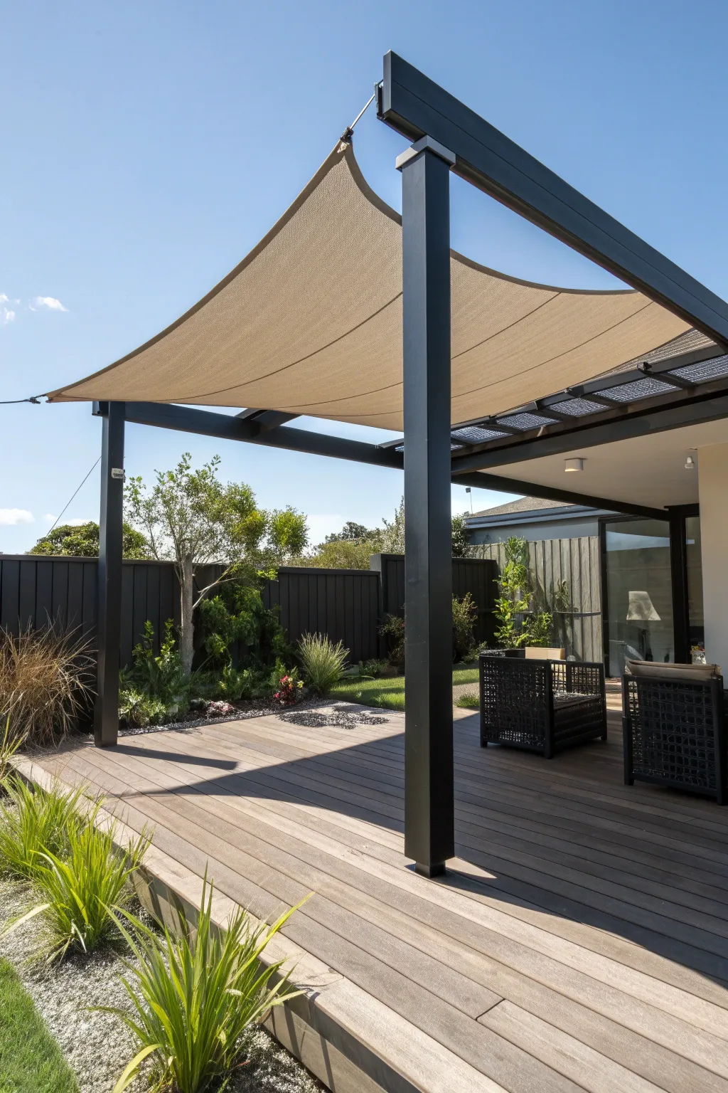 Elevate your outdoor space with a seamless pergola and shade sail integration.
