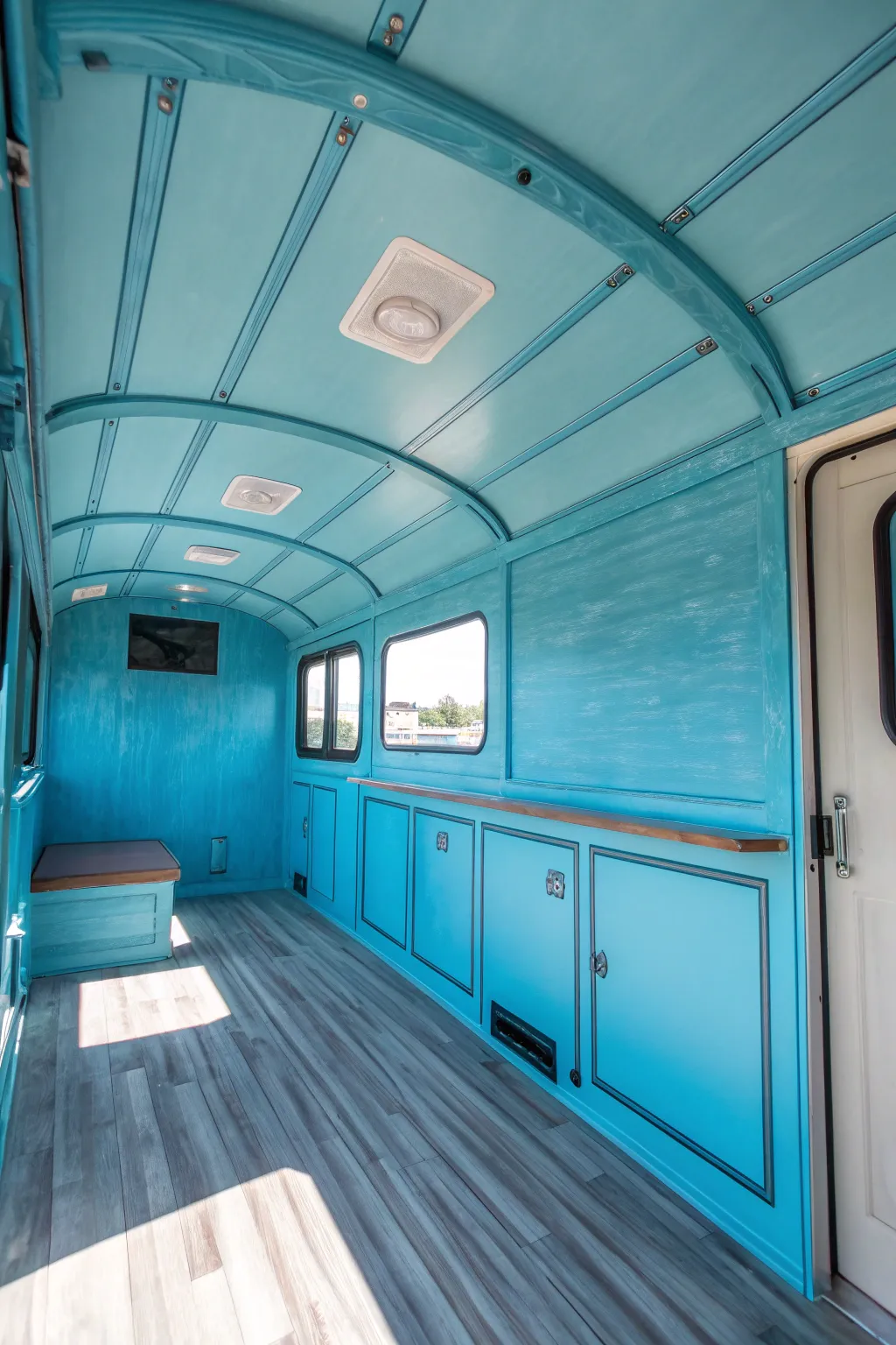 Escape into serenity with this ocean blue trailer interior, where every journey feels like a peaceful retreat.