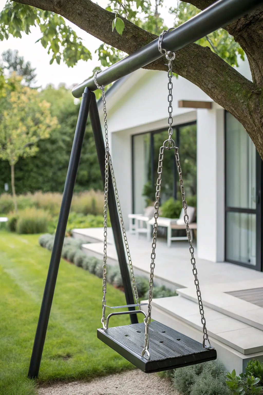 Elevate your garden with this sleek metal frame swing: where modern design meets natural elegance.