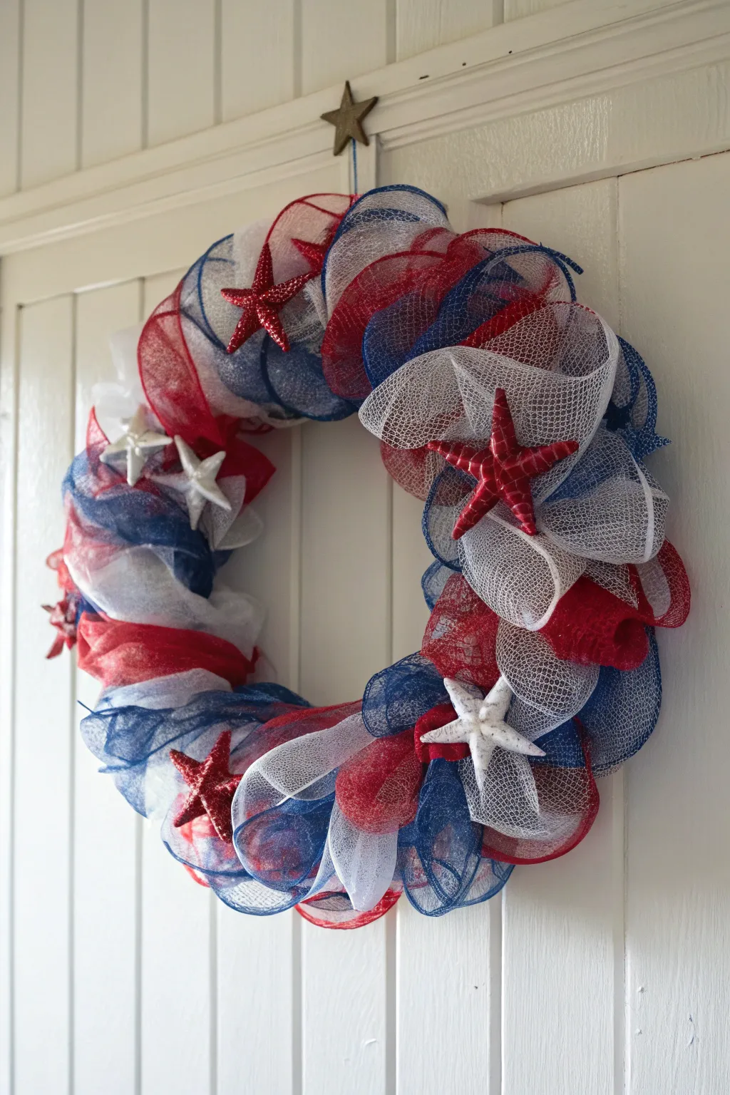 Celebrate with style: A patriotic deco mesh wreath that blends minimalist charm with festive flair.