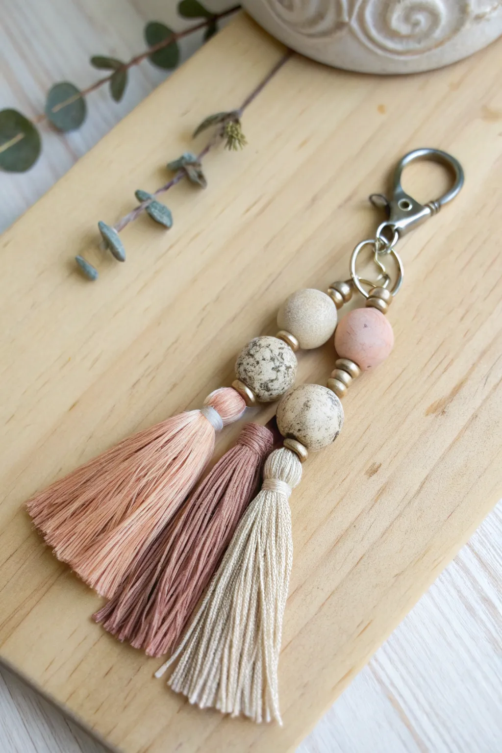 Elevate your keys with a touch of artistry – discover the Clay Tassel Fusion for a perfect blend of simplicity and charm.