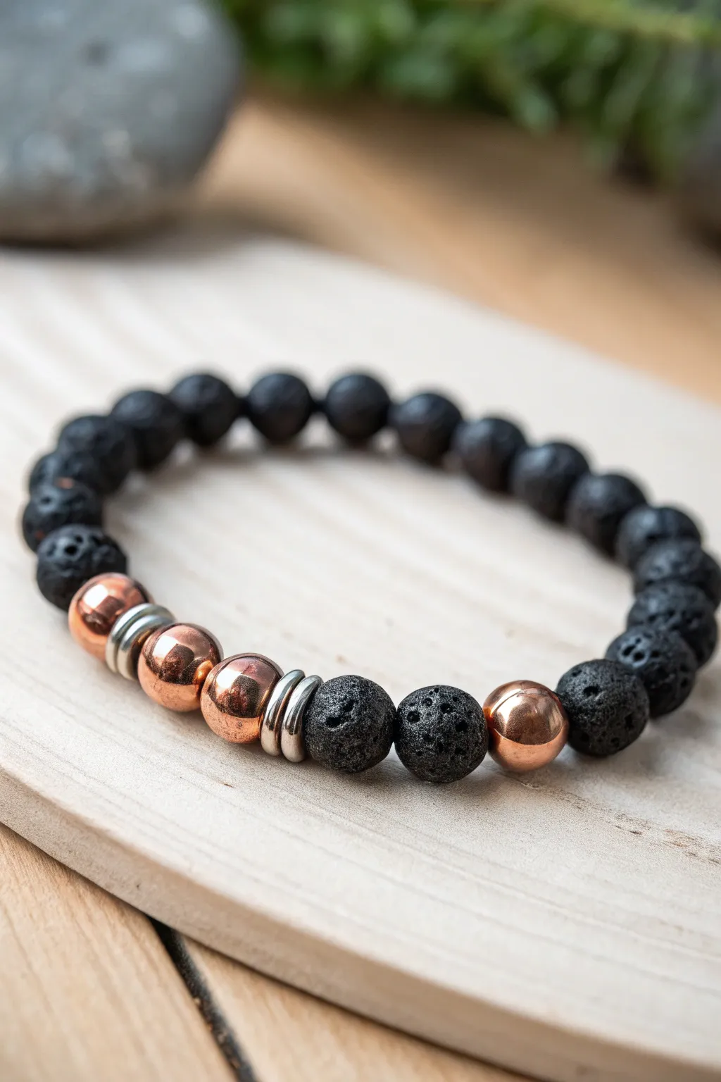 Embrace elegance with a touch of industrial flair: Discover the beauty of mixed metal and lava bead bracelets.