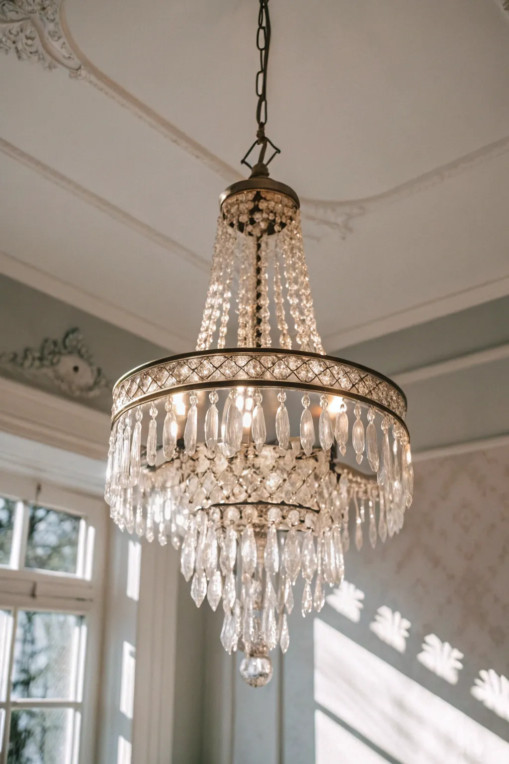 Elevate your space with the timeless elegance of a vintage crystal chandelier.