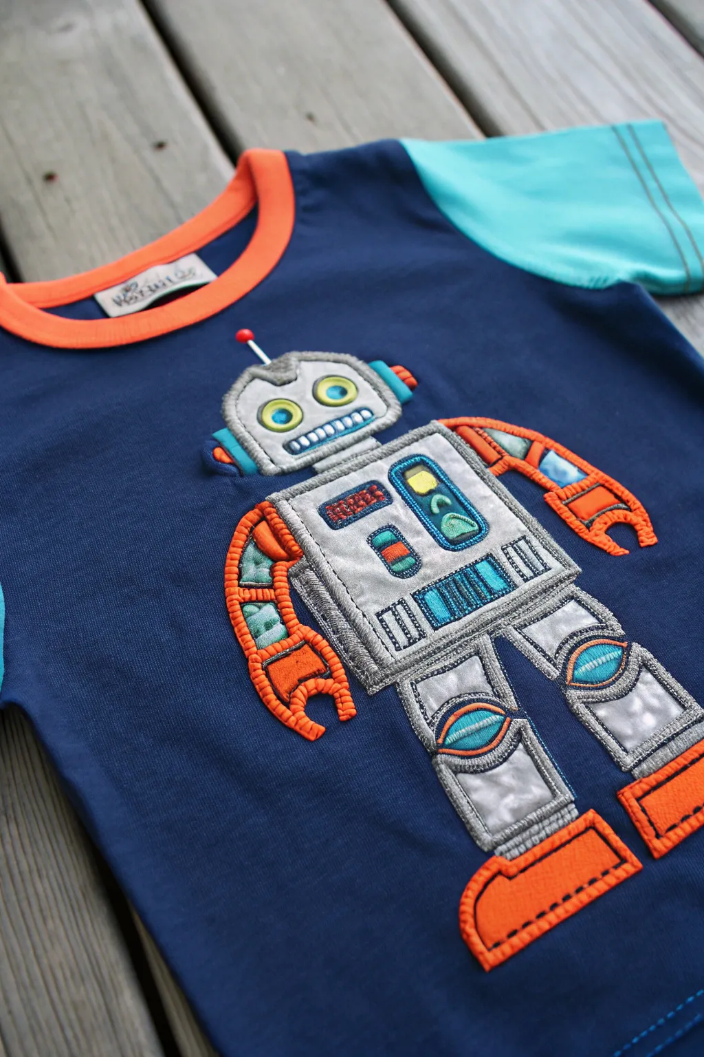 Elevate your kid's style with a personalized robot appliqué shirt – where creativity meets fashion!