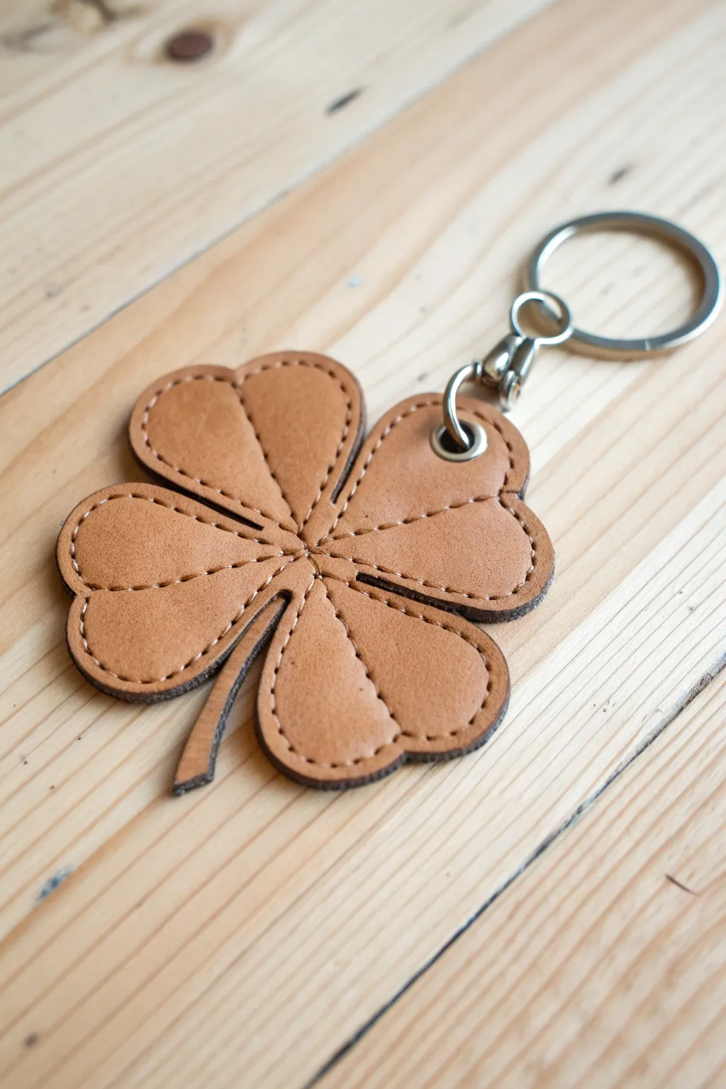 Elevate your style with a touch of eco-friendly chic: Handmade Shamrock Keychain crafted from repurposed leather.