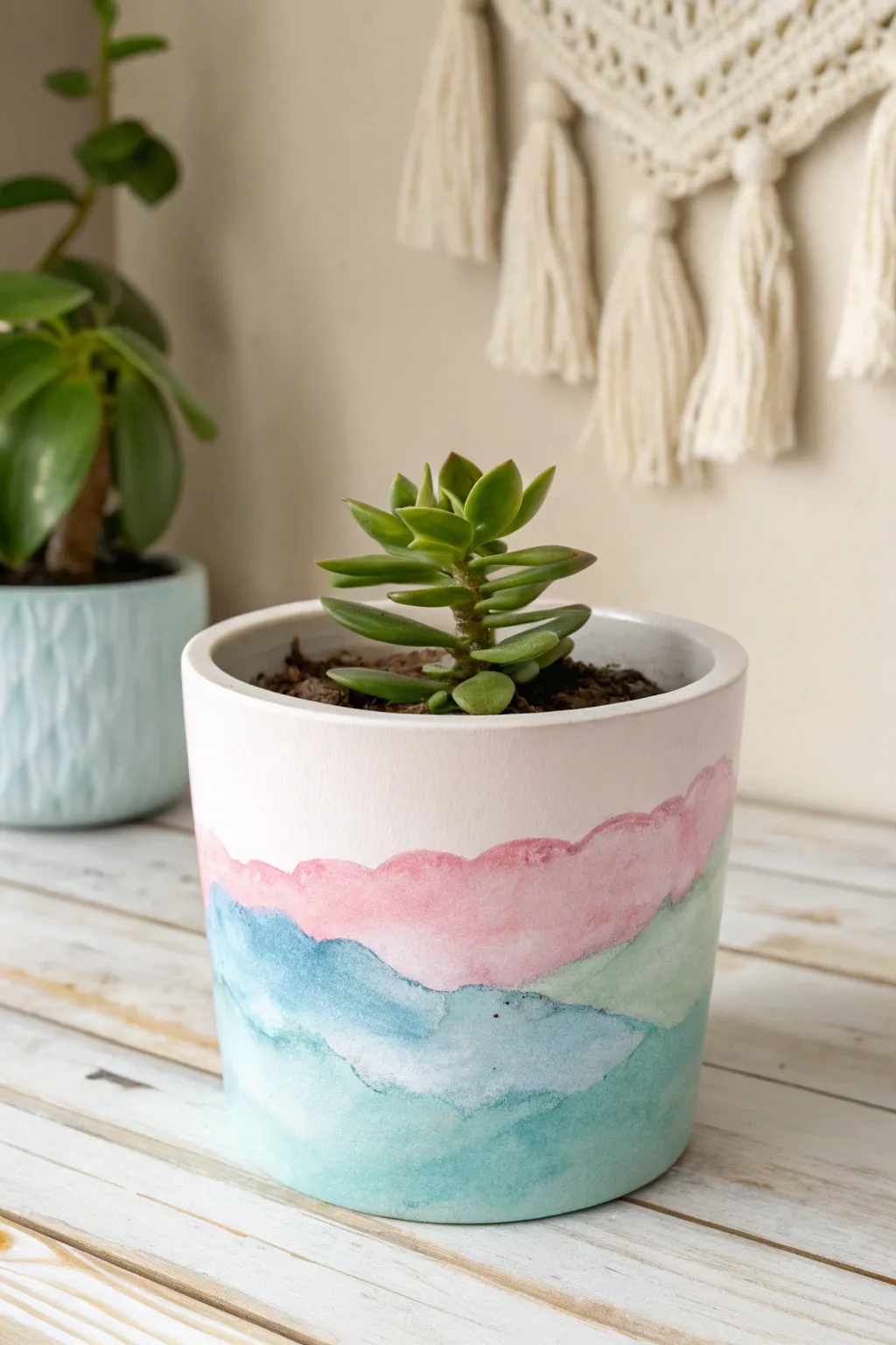 Transform your plant pots into artistic masterpieces with watercolor designs that bring a touch of nature and creativity to your space.