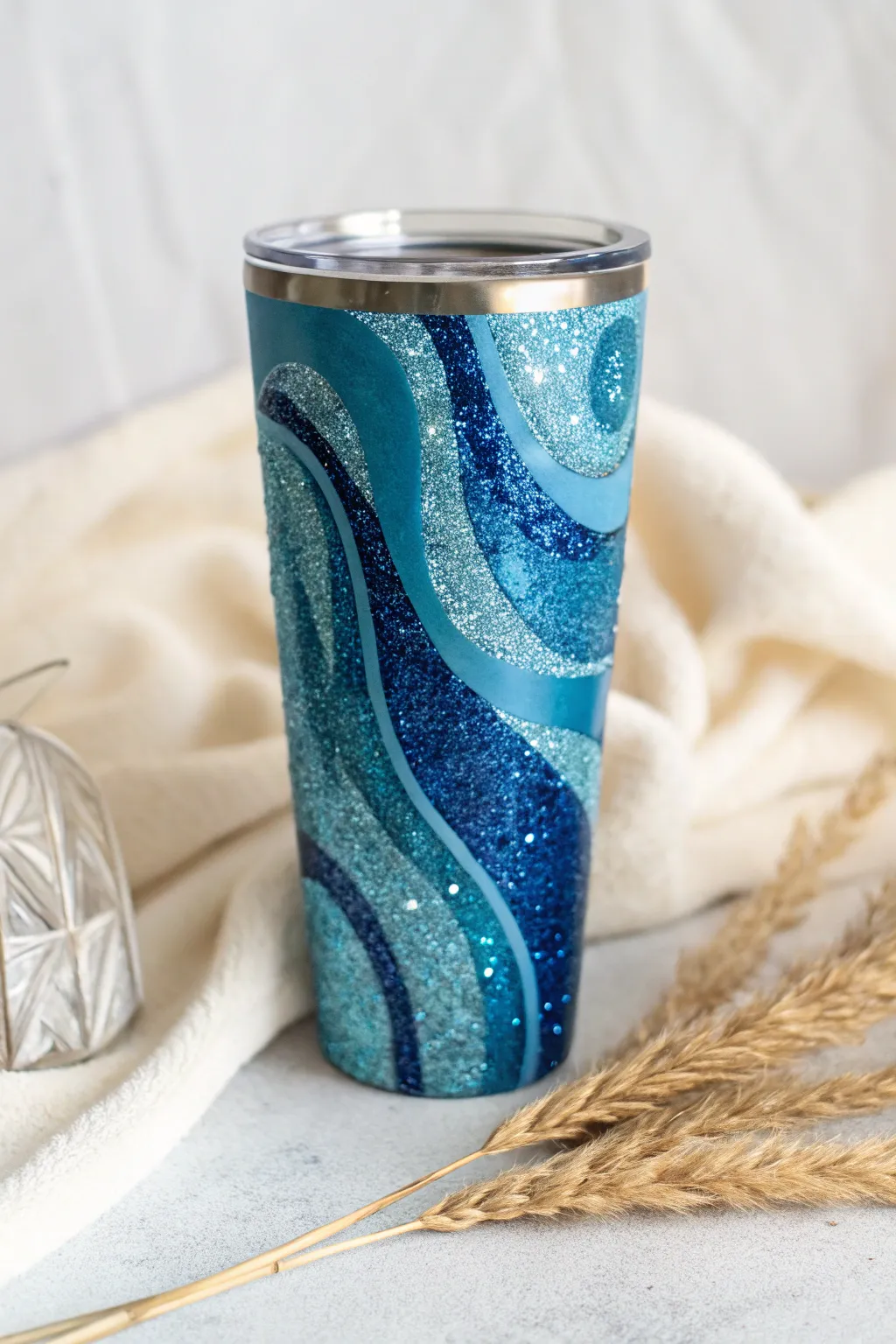 Embrace the allure of abstract art with this stunning blue glitter tumbler. Perfectly minimal, beautifully crafted.