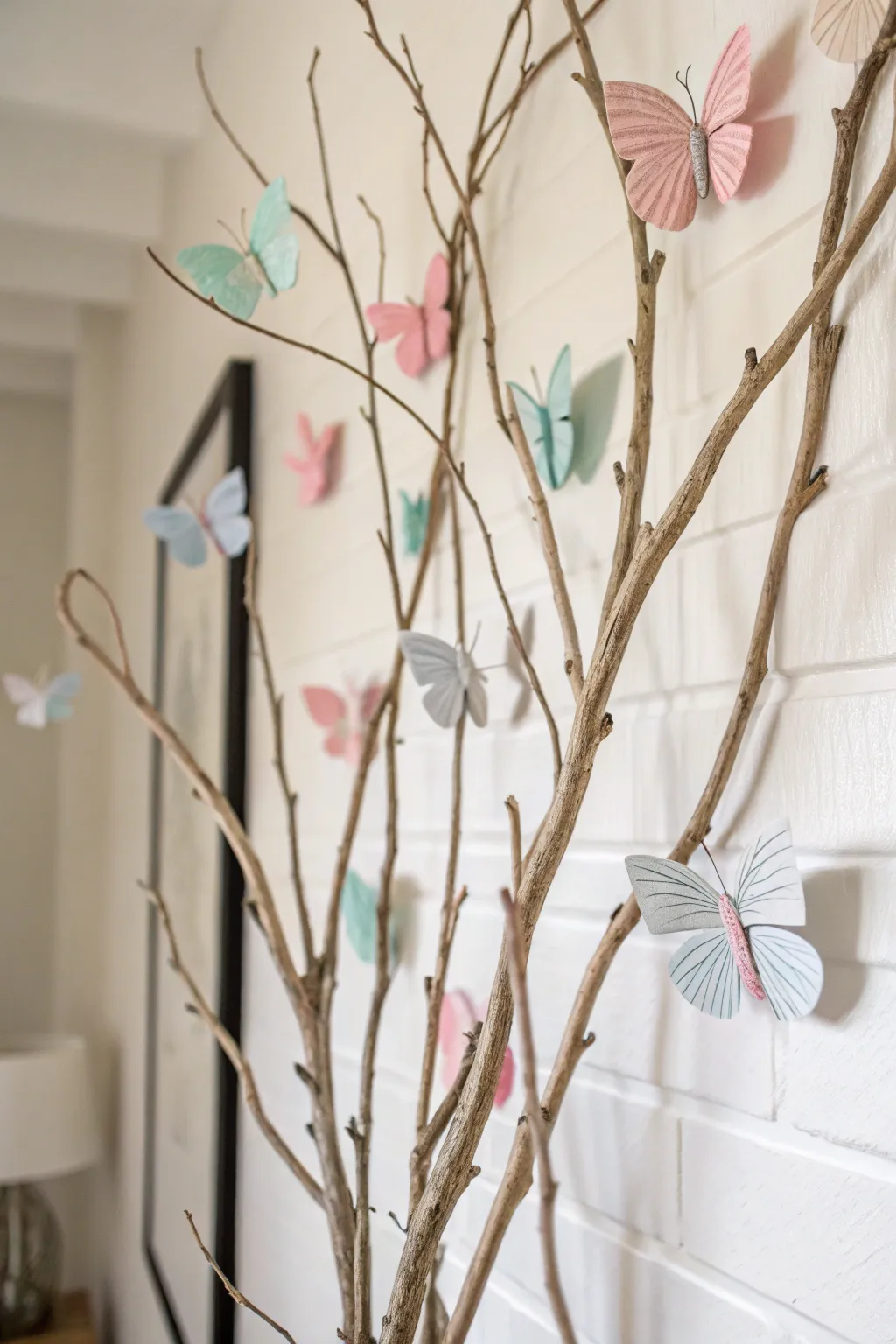 Bring the outdoors in with a touch of elegance: delicate butterflies on rustic branches for a serene wall display.