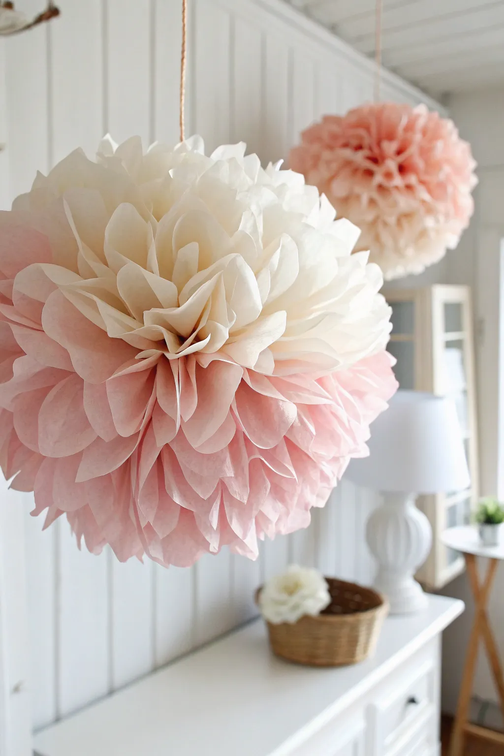 Effortless elegance: Elevate your party decor with handcrafted crepe paper pom-poms.