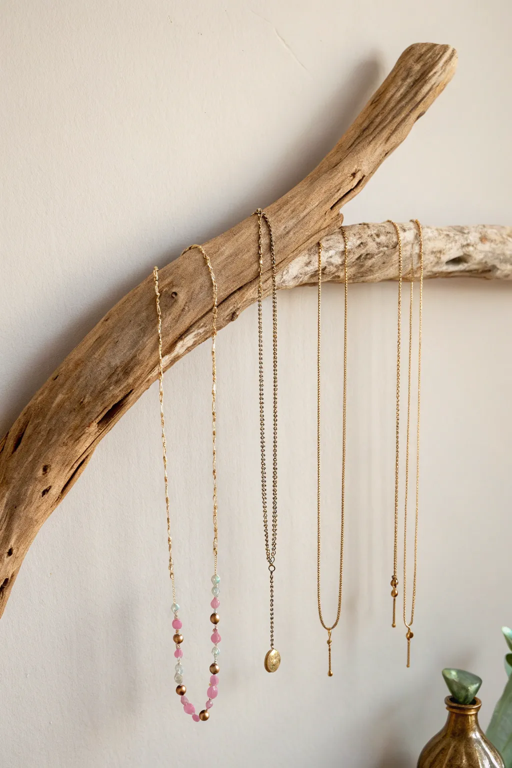 Elevate your jewelry display with a minimalist driftwood hanger—where nature meets elegance.