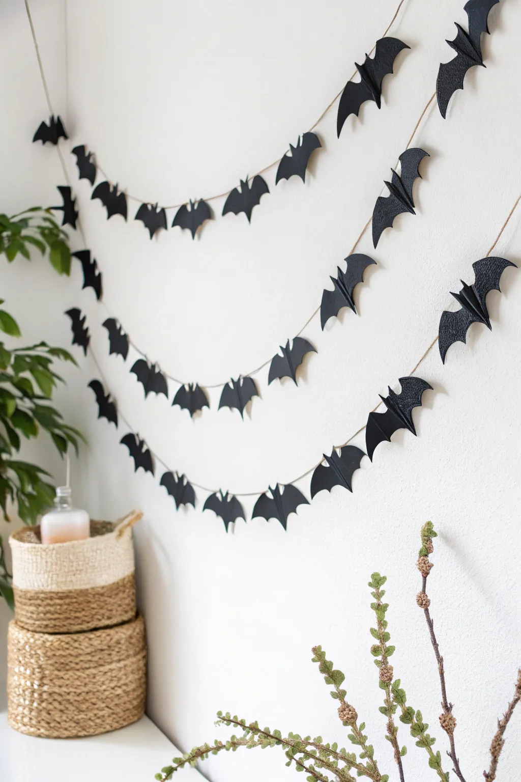 Add a touch of spooky elegance with this DIY bat garland, perfect for a minimalist Halloween vibe.