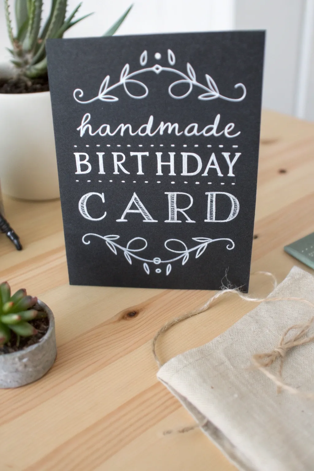 Invite a touch of rustic elegance into your birthday wishes with this charming chalkboard-inspired card.