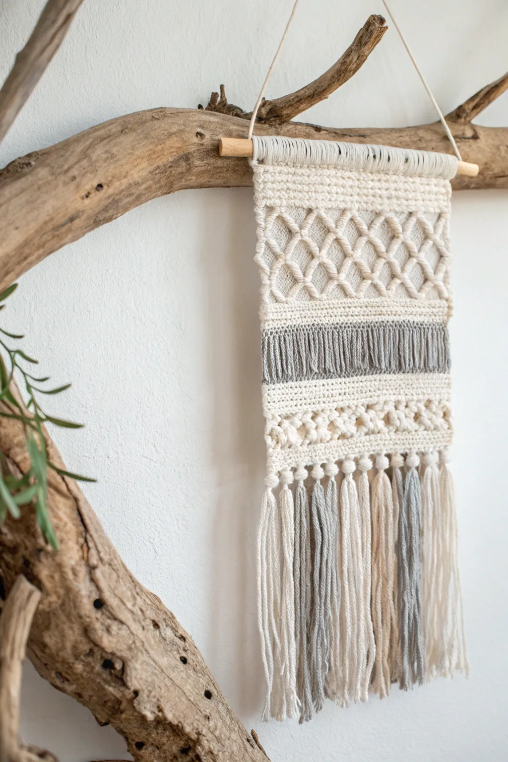 Embrace nature's charm with this stunning loom weaving on driftwood—a perfect blend of simplicity and elegance.
