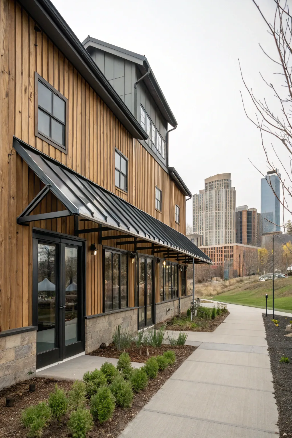 Industrial metal awnings add a modern edge to this urban farmhouse.