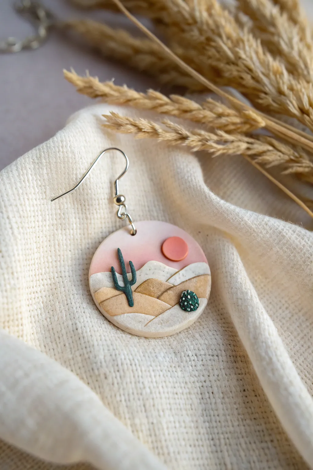 Tiny desert dreams: Elevate your style with these whimsical landscape earrings.