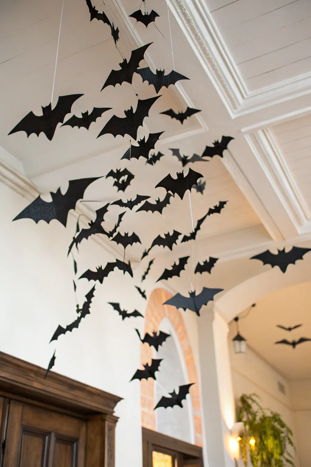 Transform your space into a chic Halloween haven with a mesmerizing bat swarm decoration.