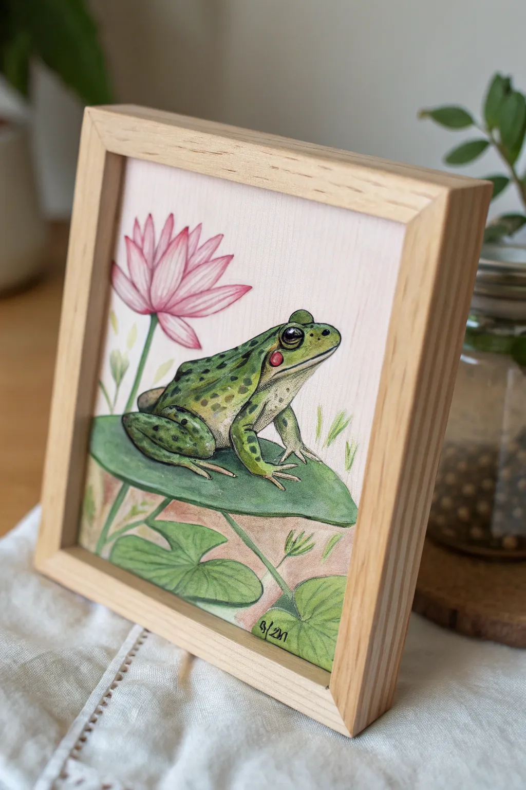 Delight in the whimsy of a cheerful frog portrait, blending minimalist elegance with boho charm.