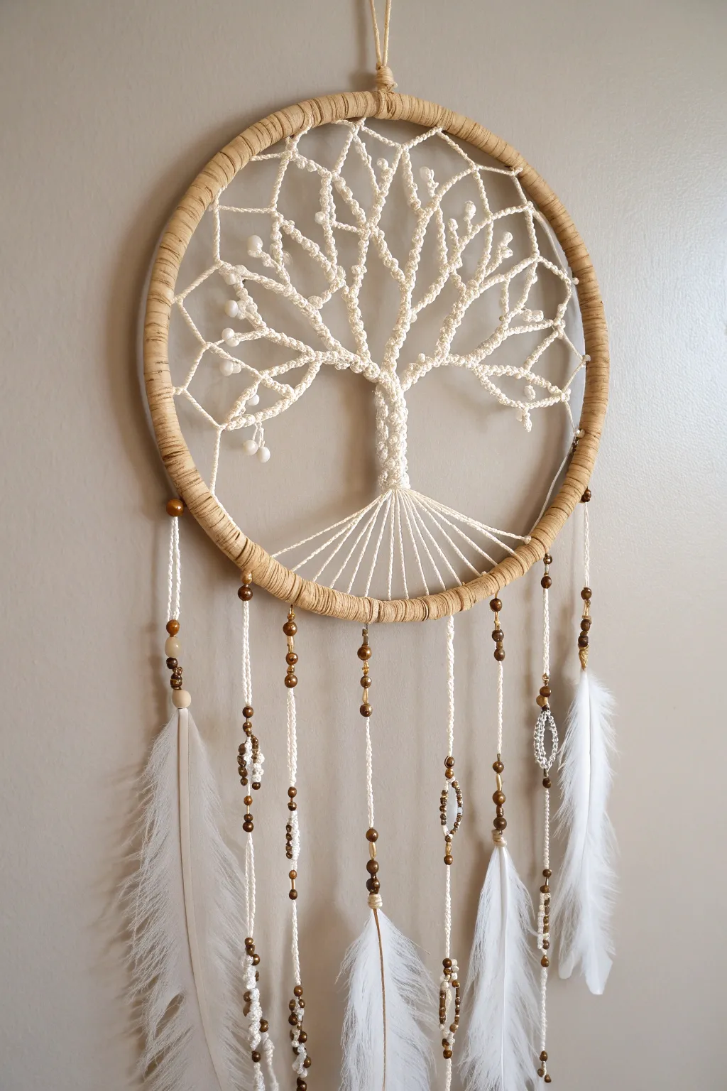 Embrace the serenity of nature with this Tree of Life dreamcatcher, a perfect blend of boho charm and minimalist elegance.