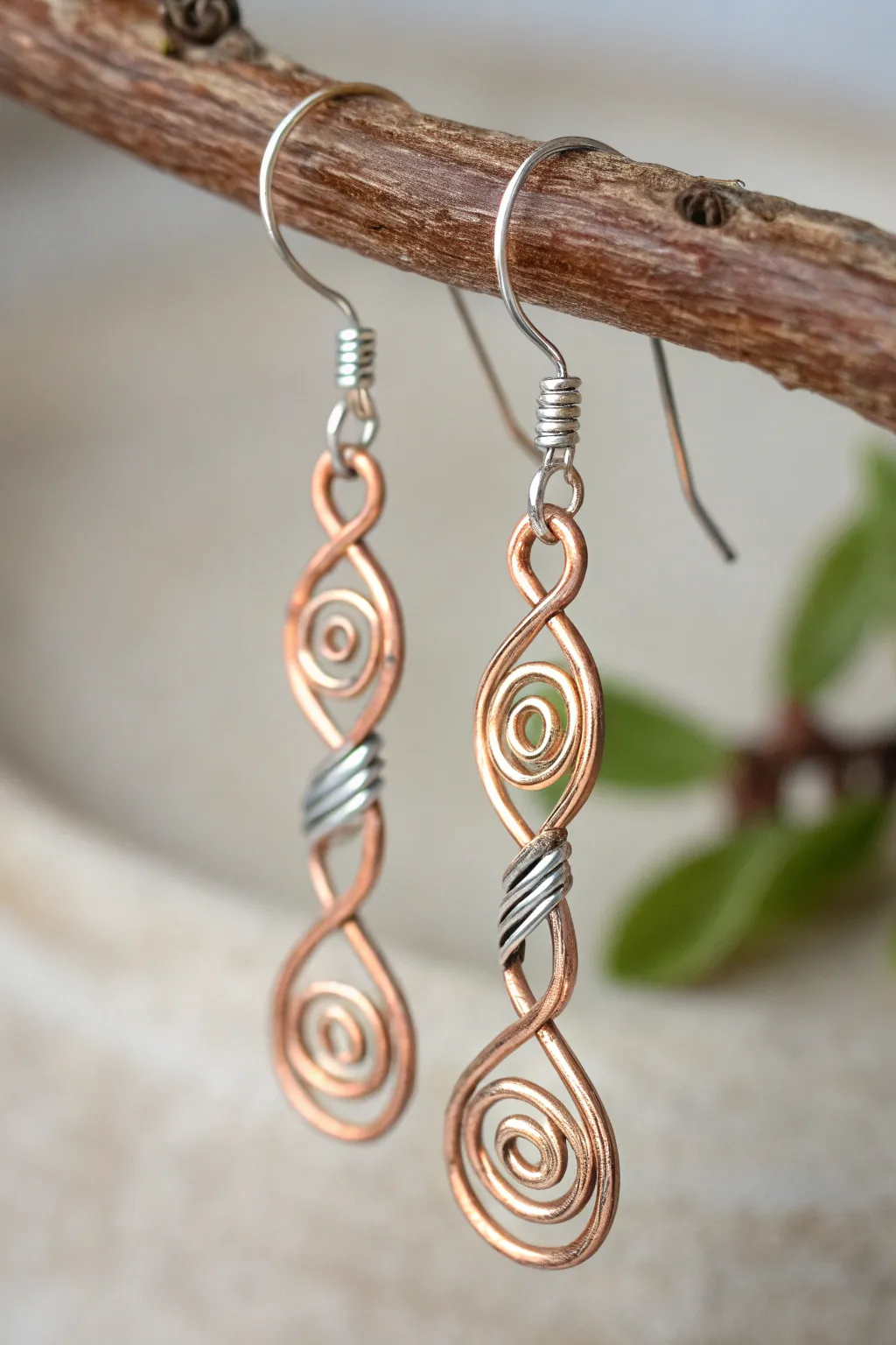 Discover the art of contrast with these exquisite copper and silver wire earrings.