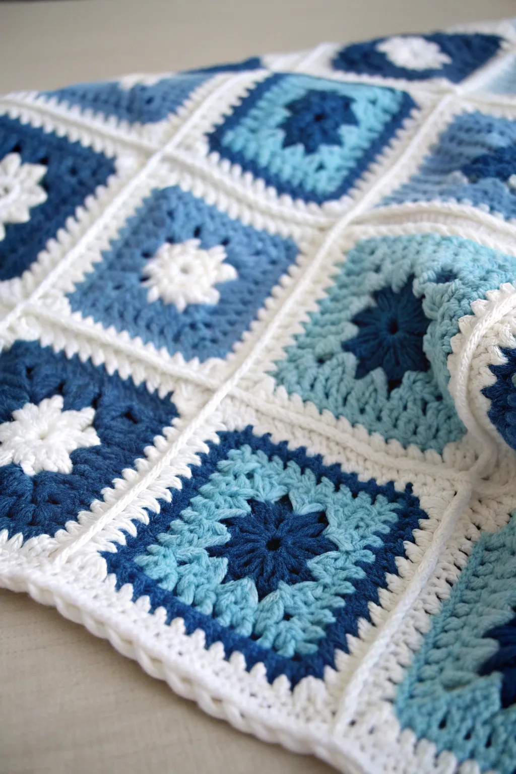 Craftsmanship meets modernity: A stunning crochet blanket for baby boys.