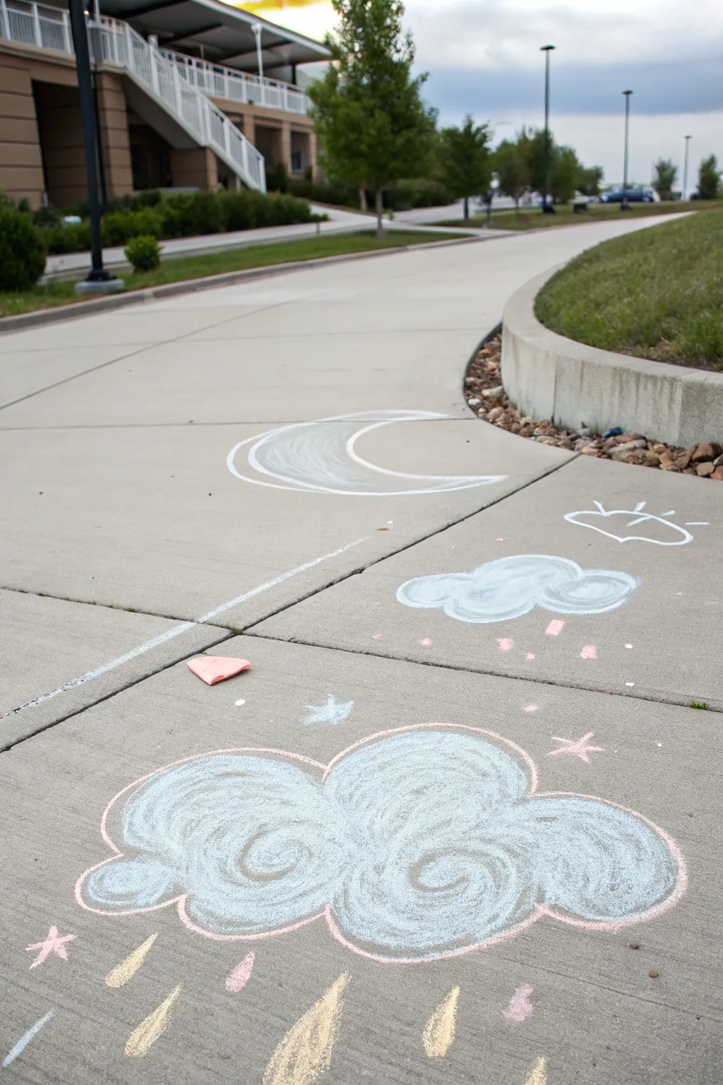 Capture calmness with whimsical cloud shapes - a simple yet enchanting sidewalk chalk art idea.