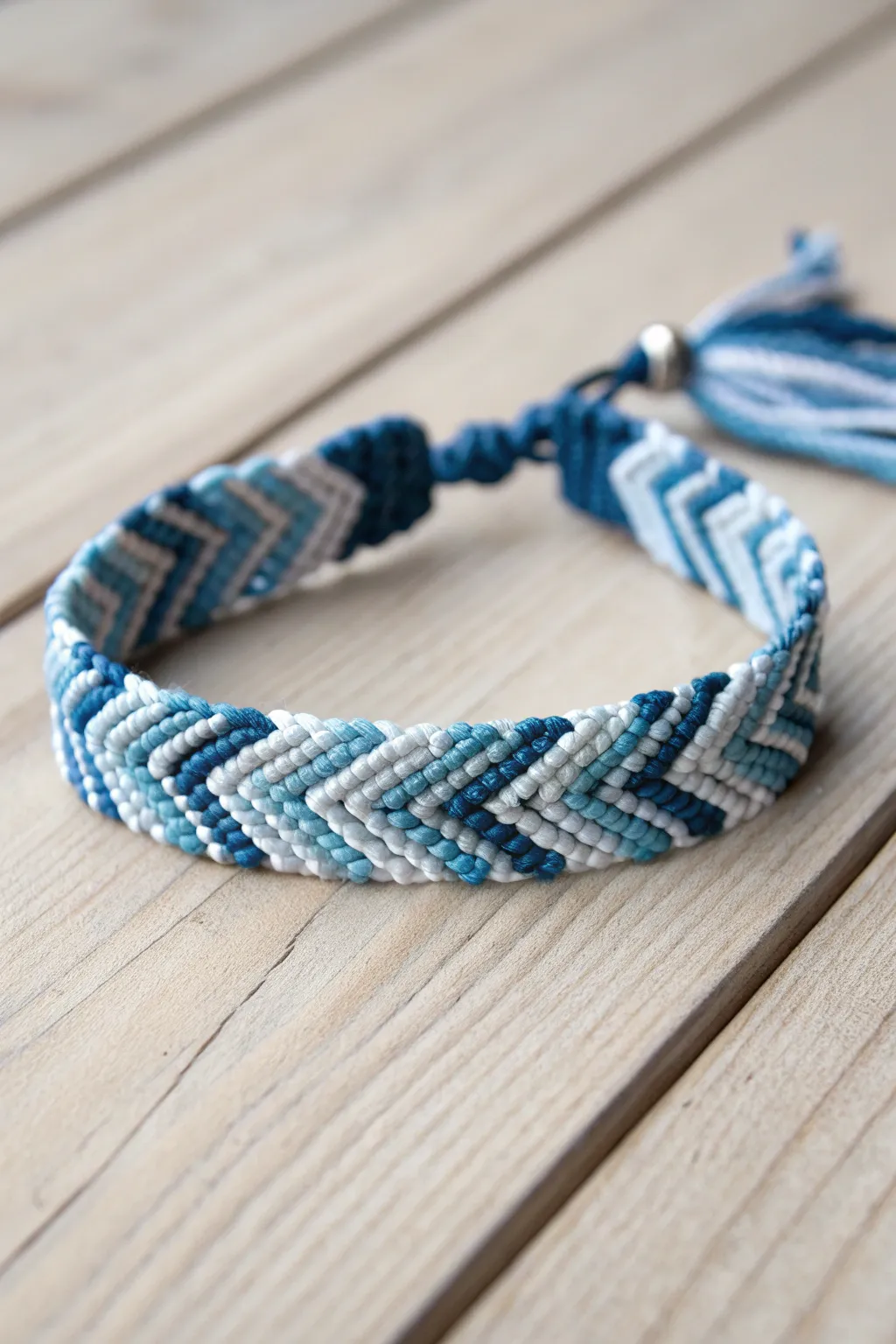 Embrace the elegance of monochrome with this handcrafted chevron bracelet in soothing blues.