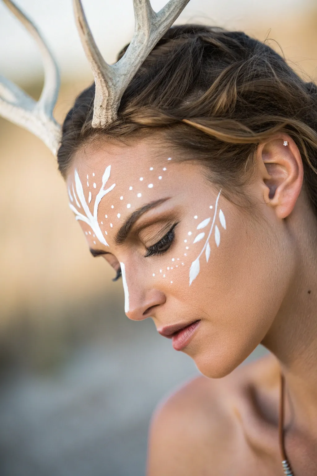 Embrace the enchanting beauty of nature with this stunning antler illusion face paint.