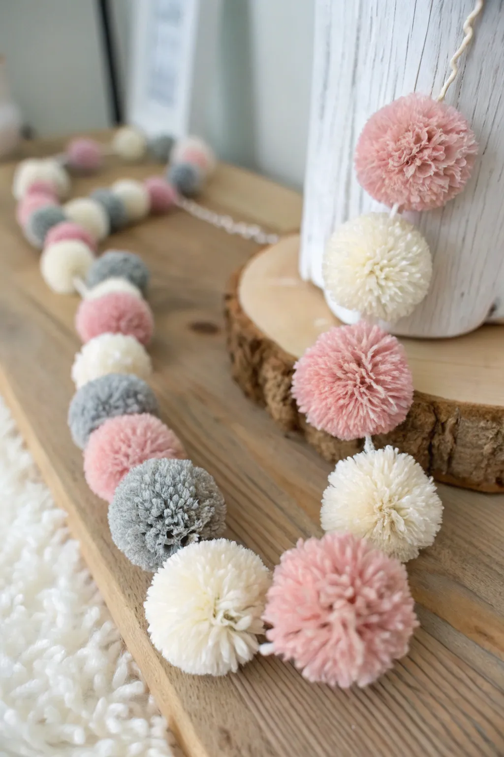 Add a playful touch to your space with a handcrafted pom pom garland, where simplicity meets creativity.