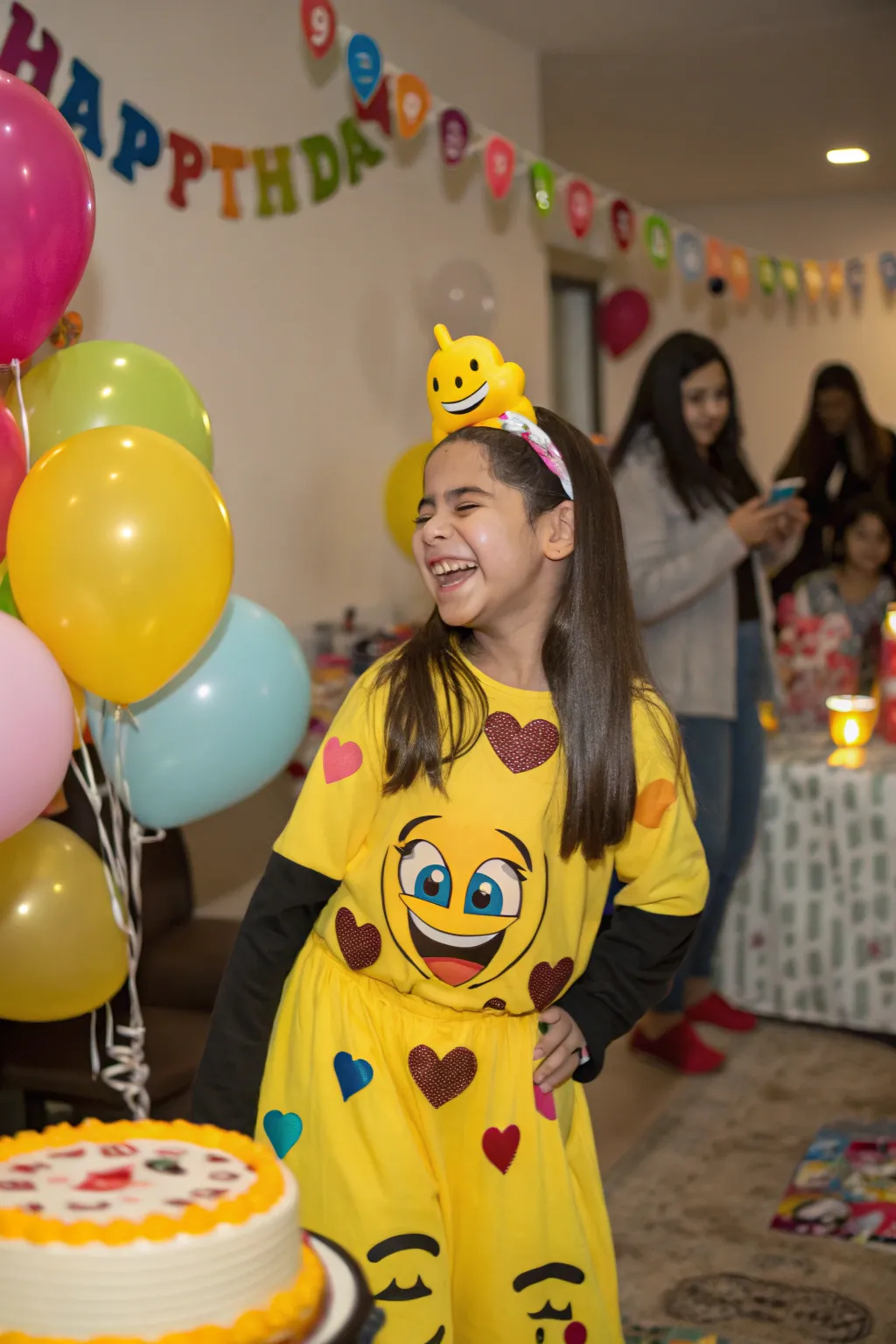The birthday girl shines in her stylish emoji-themed attire.