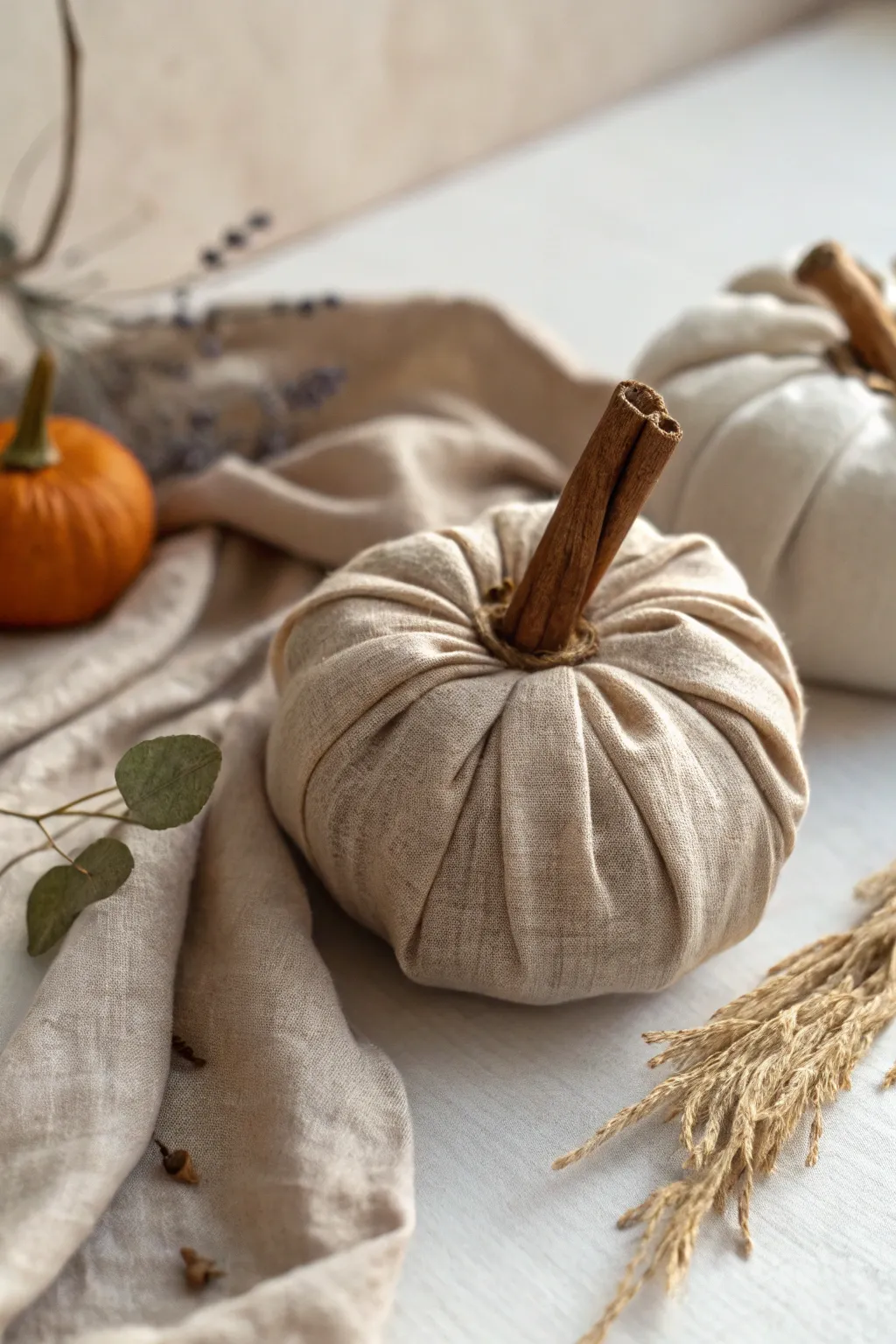 Elevate your autumn decor with this nature-inspired fabric pumpkin, where simplicity meets aromatic charm.
